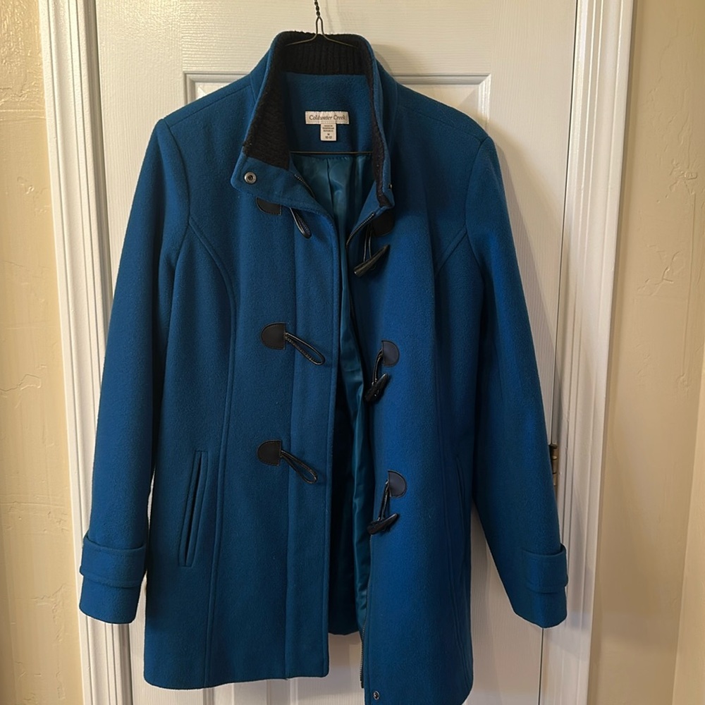 Beautiful blue, black casual jacket.zipper front button at bottom of sleeve